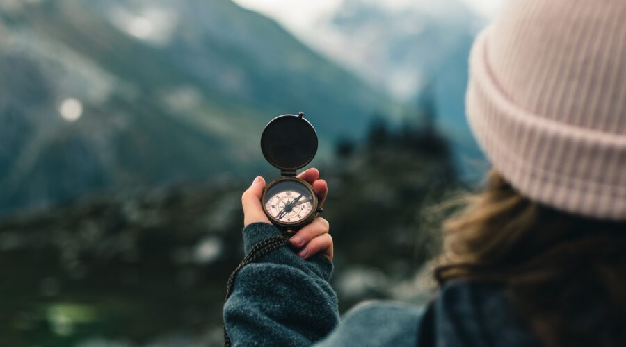 person holding black round container