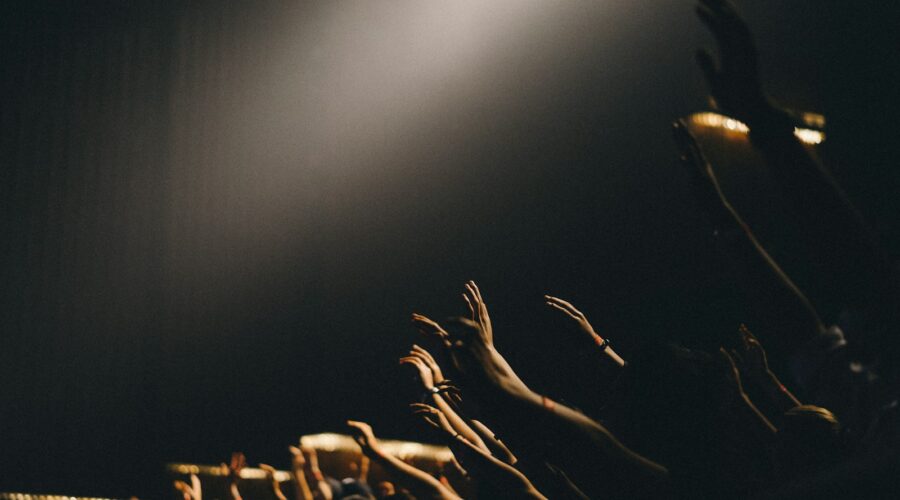 group of people waving their hands