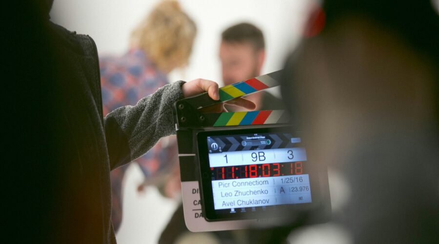 person holding clapperboard