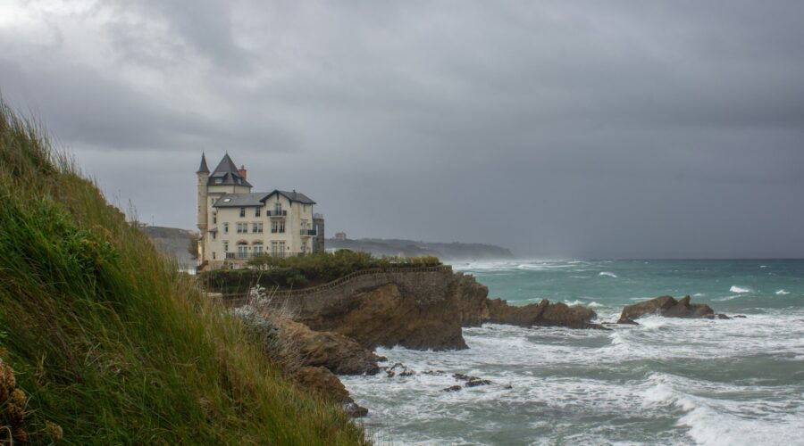 a house on a cliff overlooking the ocean