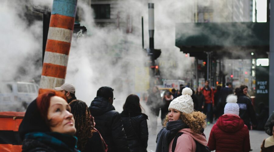 people standing near teal concrete building