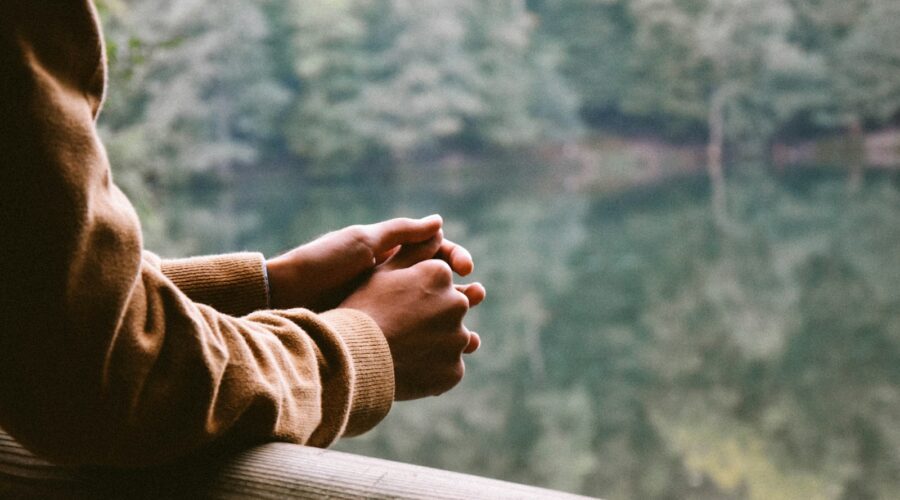 tilt-shift photography of person in brown jacket