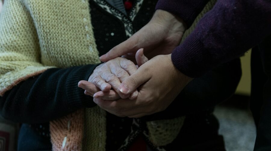 a group of people holding hands in a circle