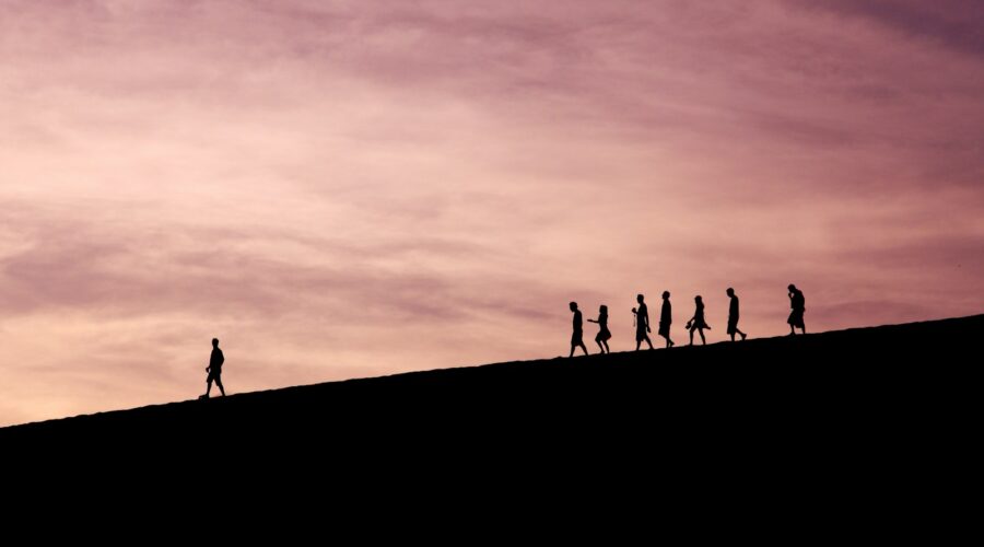 silhouette of people on hill